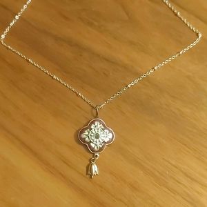 Enamel Purple floral Pendant on  18 inch Silver Plated chain.